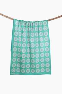 Sunkissed sand-free beach towel with repeating circular pattern shown from the back