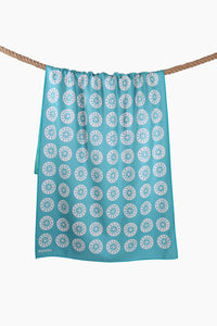 Sunkissed sand-free beach towel with repeating circular pattern shown from the front