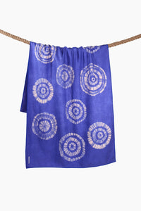 Blue tie-dye shibori sand-free beach towel with circular pattern shown from the back
